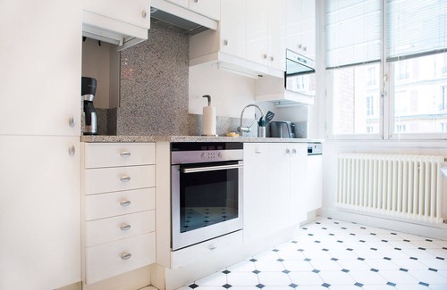 Quartier du Gros-Caillou Apartment | Experience Opulent Parisian Living with Twinkling Eiffel Views