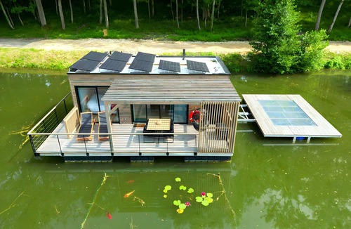 Sainte-Gemme Boat Rental | House Boat 'L'Othentique, Écolodge Flottant' with Lake View, Shared Garden and Air Conditioning
