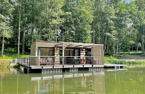 Sainte-Gemme Boat Rental | House Boat 'L'Othentique, Écolodge Flottant' with Lake View, Shared Garden and Air Conditioning