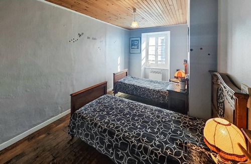 Angles House | Spend a relaxing vacation in this inviting cottage with rustic charm.