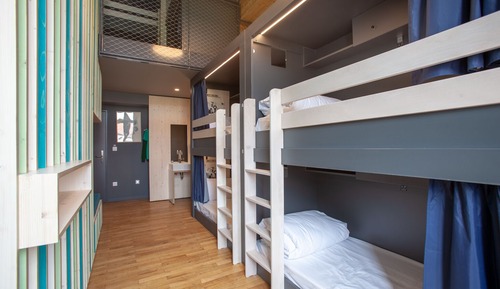 Bed in 6 bed female room with shared bath room